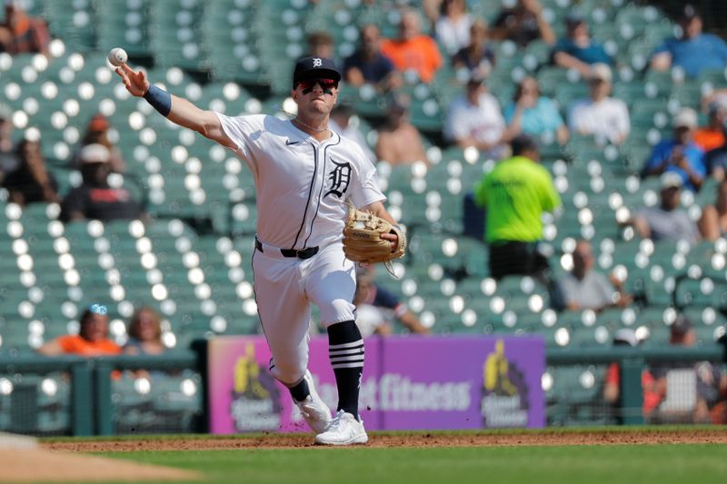 Sep 12, 2024; Detroit, Michigan, USA;  Detroit Tigers third baseman Jace Jung (17) makes a throw in the third inning against the Colorado Rockies at Comerica Park. Mandatory Credit: Rick Osentoski-Imagn Images
