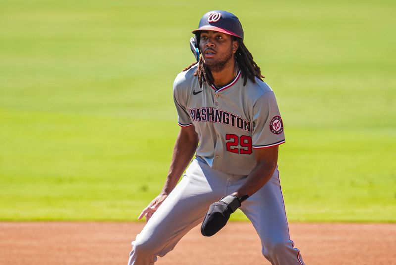 Aug 25, 2024; Cumberland, Georgia, USA; Washington Nationals left fielder James Wood (29) leads off of first base against the Atlanta Braves during the first inning at Truist Park. Mandatory Credit: Dale Zanine-USA TODAY Sports