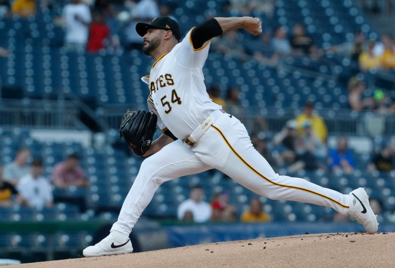 May 21, 2024; Pittsburgh, Pennsylvania, USA;  Pittsburgh Pirates starting pitcher Martín Pérez (54) delivers a pitch against the San Francisco Giants during the first inning at PNC Park. Mandatory Credit: Charles LeClaire-USA TODAY Sports