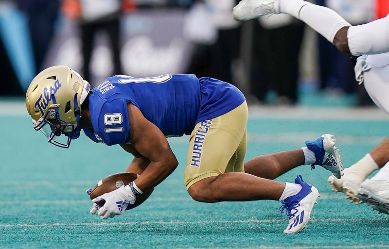 Dec 20, 2021; Conway, South Carolina, USA; Tulsa Golden Hurricane safety Brad Hensley (18) fumbles the ball in the fourth quarter against the Old Dominion Monarchs during the 2021 Myrtle Beach Bowl at Brooks Stadium. Mandatory Credit: David Yeazell-USA TODAY Sports