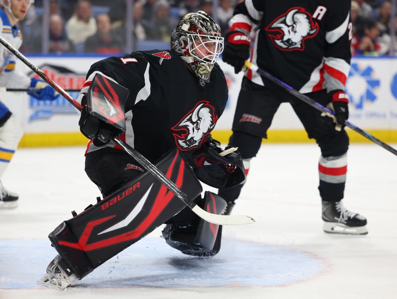 Nov 6, 2025; Buffalo, New York, USA;  Buffalo Sabres goaltender Ukko-Pekka Luukkonen (1) looks for the puck during the first period against the St. Louis Blues at KeyBank Center. Mandatory Credit: Timothy T. Ludwig-Imagn Images