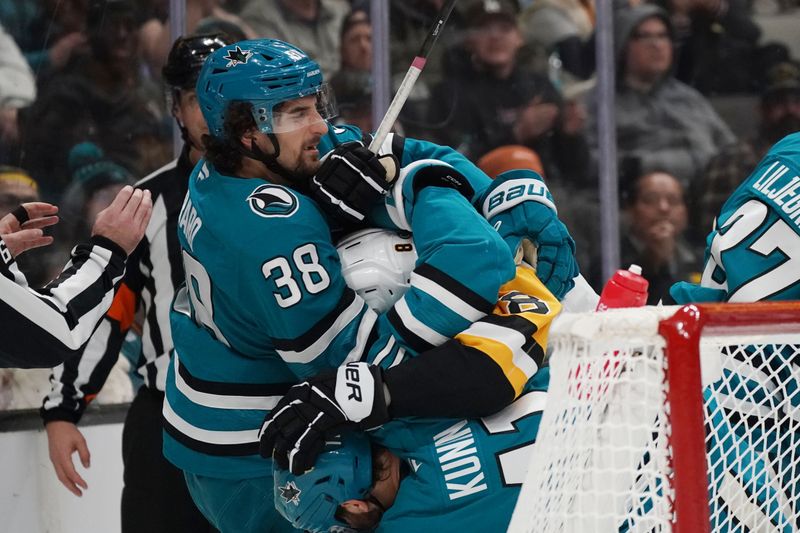 Jan 27, 2025; San Jose, California, USA;  San Jose Sharks defenseman Mario Ferraro (38) and center Luke Kunin (11) get into a shoving match with Pittsburgh Penguins left winger Michael Bunting (8) in the third period at SAP Center at San Jose. Mandatory Credit: David Gonzales-Imagn Images