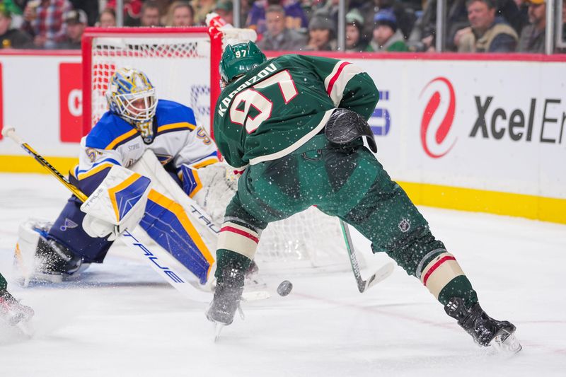 Nov 28, 2023; Saint Paul, Minnesota, USA; Minnesota Wild left wing Kirill Kaprizov (97) skates with the puck against the St. Louis Blues goaltender Jordan Binnington (50) in the second period at Xcel Energy Center. Mandatory Credit: Brad Rempel-USA TODAY Sports