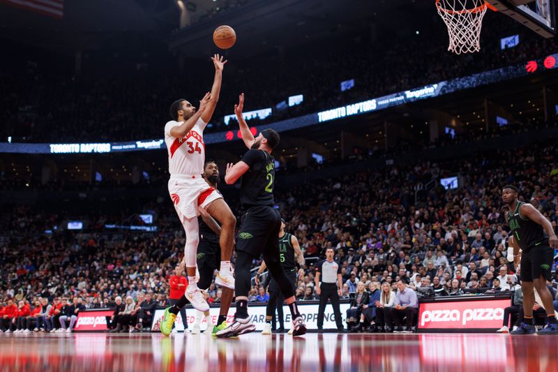 TORONTO, CANADA - MARCH 5: Jontay Porter #34 of the Toronto Raptors puts up a shot over Larry Nance Jr. #22 of the New Orleans Pelicans during the first half of their NBA game at Scotiabank Arena on March 5, 2024 in Toronto, Canada. NOTE TO USER: User expressly acknowledges and agrees that, by downloading and or using this photograph, User is consenting to the terms and conditions of the Getty Images License Agreement. (Photo by Cole Burston/Getty Images)