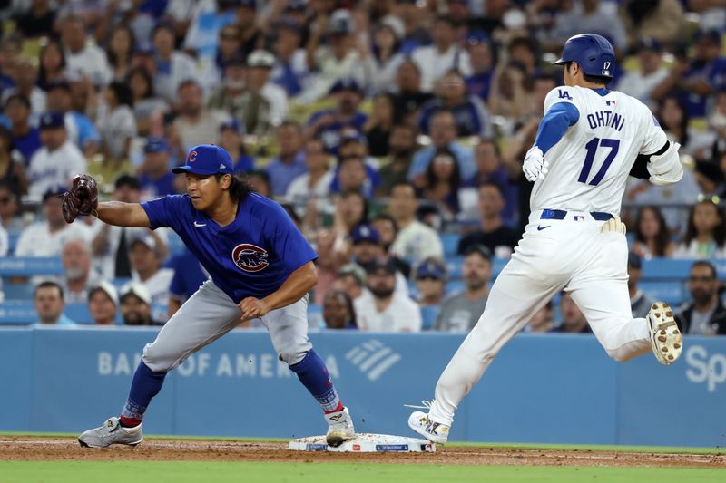 Sep 10, 2024; Los Angeles, California, USA;  Los Angeles Dodgers designated hitter Shohei Ohtani (17) grounds into a double play as Chicago Cubs starting pitcher Shota Imanaga (18) complete a double play at first base during the third inning against the Chicago Cubs at Dodger Stadium. Mandatory Credit: Kiyoshi Mio-Imagn Images