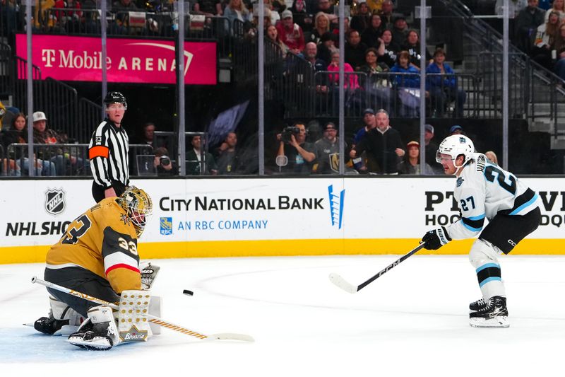 Nov 2, 2024; Las Vegas, Nevada, USA; Vegas Golden Knights goaltender Adin Hill (33) makes a save against Utah Hockey Club center Barrett Hayton (27) during the first period at T-Mobile Arena. Mandatory Credit: Stephen R. Sylvanie-Imagn Images