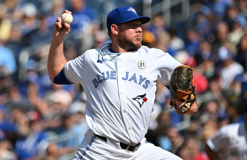 Sep 15, 2024; Toronto, Ontario, CAN;  Toronto Blue Jays starting pitcher Yariel Rodriguz (29) delivers a pitch against the St. Louis Cardinals in the first inning at Rogers Centre. Mandatory Credit: Dan Hamilton-Imagn Images