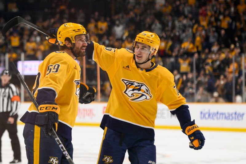 Nov 27, 2024; Nashville, Tennessee, USA;  Nashville Predators defenseman Roman Josi (59) celebrates after his goal with and defenseman Brady Skjei (76) during the first period against the Philadelphia Flyers at Bridgestone Arena. Mandatory Credit: Steve Roberts-Imagn Images