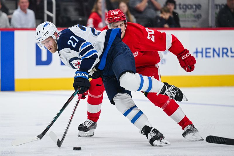 Oct 30, 2024; Detroit, Michigan, USA; Detroit Red Wings defenseman Albert Johansson (20) trips Winnipeg Jets left wing Nikolaj Ehlers (27) during the third period at Little Caesars Arena. Mandatory Credit: Tim Fuller-Imagn Images