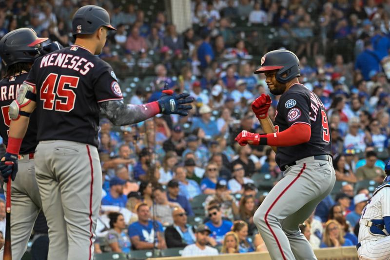 Jul 17, 2023; Chicago, Illinois, USA;  Washington Nationals third baseman Jeimer Candelario (9) celebrates after he hits a two-run home run against the Chicago Cubs during the first inning at Wrigley Field. Mandatory Credit: Matt Marton-USA TODAY Sports