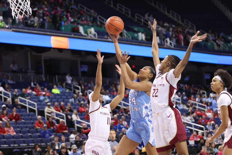 Mar 7, 2025; Greensboro, NC, USA;  North Carolina Tar Heels guard Indya Nivar (24) goes for a lay up during the first quarter at First Horizon Coliseum. Mandatory Credit: Cory Knowlton-Imagn Images