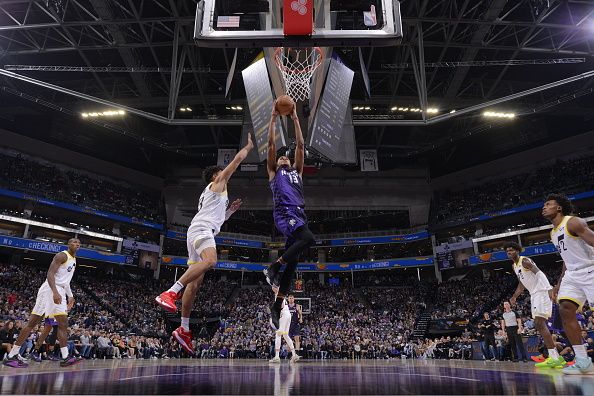 SACRAMENTO, CA - DECEMBER 16: Keegan Murray #13 of the Sacramento Kings drives to the basket during the game against the Utah Jazz on December 16, 2023 at Golden 1 Center in Sacramento, California. NOTE TO USER: User expressly acknowledges and agrees that, by downloading and or using this Photograph, user is consenting to the terms and conditions of the Getty Images License Agreement. Mandatory Copyright Notice: Copyright 2023 NBAE (Photo by Rocky Widner/NBAE via Getty Images)