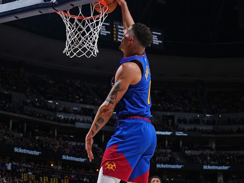 DENVER, CO - JANUARY 12: Michael Porter Jr. #1 of the Denver Nuggets dunks the ball during the game against the New Orleans Pelicans on January 12, 2024 at the Ball Arena in Denver, Colorado. NOTE TO USER: User expressly acknowledges and agrees that, by downloading and/or using this Photograph, user is consenting to the terms and conditions of the Getty Images License Agreement. Mandatory Copyright Notice: Copyright 2024 NBAE (Photo by Garrett Ellwood/NBAE via Getty Images)