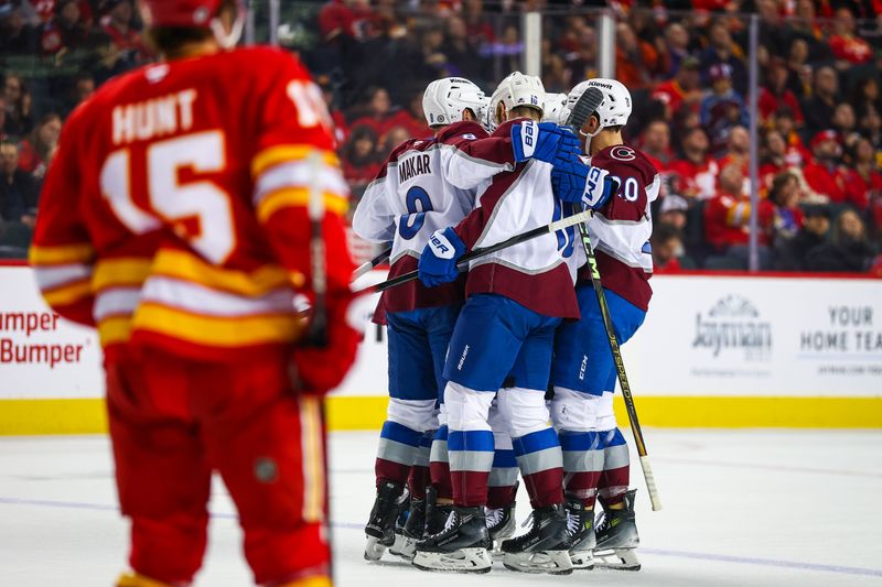 Mar 14, 2025; Calgary, Alberta, CAN; Colorado Avalanche defenseman Ryan Lindgren (55) celebrates his goal with teammates against the Calgary Flames during the first period at Scotiabank Saddledome. Mandatory Credit: Sergei Belski-Imagn Images