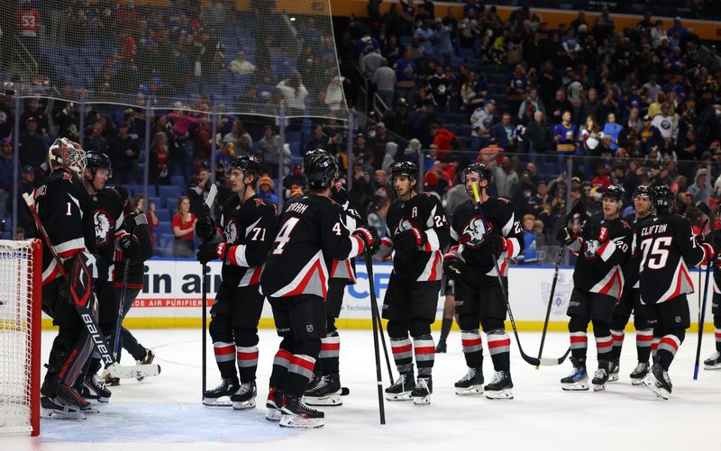 Oct 26, 2024; Buffalo, New York, USA;  The Buffalo Sabres celebrate a win over the Detroit Red Wings at KeyBank Center. Mandatory Credit: Timothy T. Ludwig-Imagn Images