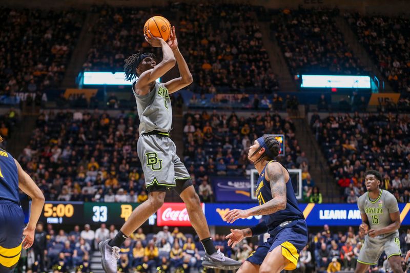 Feb 17, 2024; Morgantown, West Virginia, USA; West Virginia Mountaineers guard Aden Tagaloa-Nelson (4) shoots a jumper during the first half against the West Virginia Mountaineers at WVU Coliseum. Mandatory Credit: Ben Queen-USA TODAY Sports