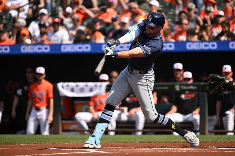 Jun 28, 2025; Baltimore, Maryland, USA; Tampa Bay Rays right fielder Josh Lowe (15) hits a double against the Baltimore Orioles during the first inning at Oriole Park at Camden Yards. Mandatory Credit: Rafael Suanes-Imagn Images