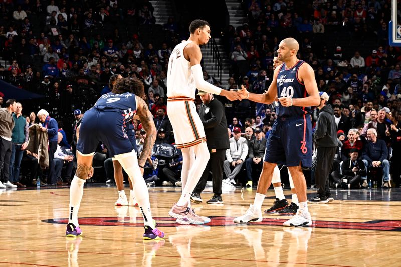 PHILADELPHIA, PA - JANUARY 22: Victor Wembanyama #1 of the San Antonio Spurs greets Nicolas Batum #40 of the Philadelphia 76ers during the game on January 22, 2024 at the Wells Fargo Center in Philadelphia, Pennsylvania NOTE TO USER: User expressly acknowledges and agrees that, by downloading and/or using this Photograph, user is consenting to the terms and conditions of the Getty Images License Agreement. Mandatory Copyright Notice: Copyright 2024 NBAE (Photo by David Dow/NBAE via Getty Images)