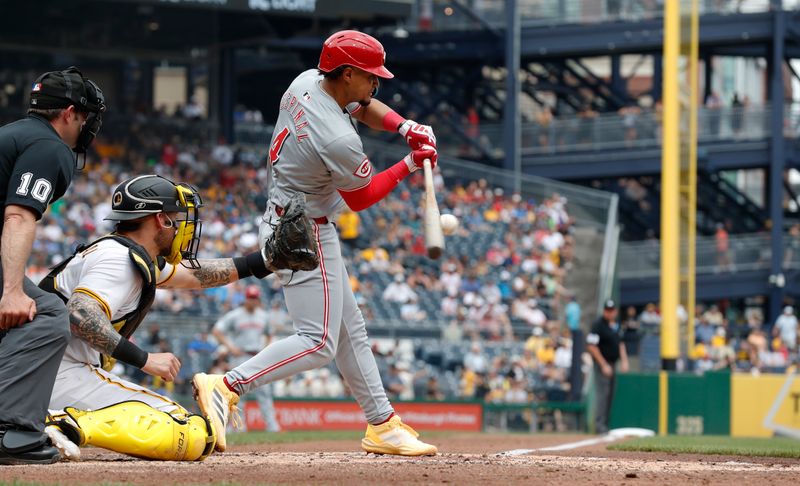 Jun 19, 2024; Pittsburgh, Pennsylvania, USA;  Cincinnati Reds third baseman Santiago Espinal (4) hits a single against the Pittsburgh Pirates during the fifth inning at PNC Park. The Pirates shutout the Reds 1-0. Mandatory Credit: Charles LeClaire-USA TODAY Sports