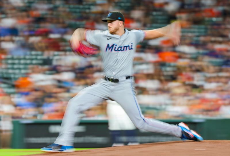 Jul 9, 2024; Houston, Texas, USA;  Miami Marlins starting pitcher Trevor Rogers (28) pitches against the Houston Astros in the fourth inning at Minute Maid Park. Mandatory Credit: Thomas Shea-USA TODAY Sports