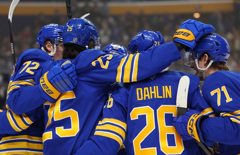 Jan 31, 2026; Buffalo, New York, USA;  Buffalo Sabres defenseman Owen Power (25) celebrates his goal with teammates during the second period against the Montréal Canadiens at KeyBank Center. Mandatory Credit: Timothy T. Ludwig-Imagn Images