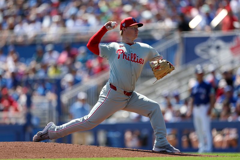 Mar 4, 2024; Dunedin, Florida, USA;  Philadelphia Phillies relief pitcher Nick Nelson (57) throws a pitch against the Toronto Blue Jays in the first inning at TD Ballpark. Mandatory Credit: Nathan Ray Seebeck-USA TODAY Sports