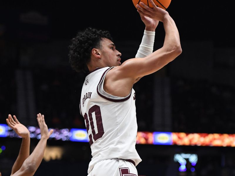 Mar 11, 2023; Nashville, TN, USA; Texas A&M Aggies guard Andre Gordon (20) shoots a jump shot during the first half against the Texas A&M Aggies at Bridgestone Arena. Mandatory Credit: Christopher Hanewinckel-USA TODAY Sports