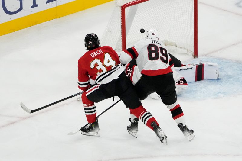 Oct 28, 2025; Chicago, Illinois, USA; Chicago Blackhawks center Colton Dach (34) scores a goal against the Ottawa Senators during the first period at United Center. Mandatory Credit: David Banks-Imagn Images