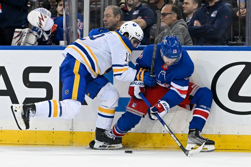 Nov 7, 2024; New York, New York, USA;  Buffalo Sabres center Peyton Krebs (19) and New York Rangers left wing Alexis Lafreniere (13) battle for the puck during the third period at Madison Square Garden. Mandatory Credit: Dennis Schneidler-Imagn Images