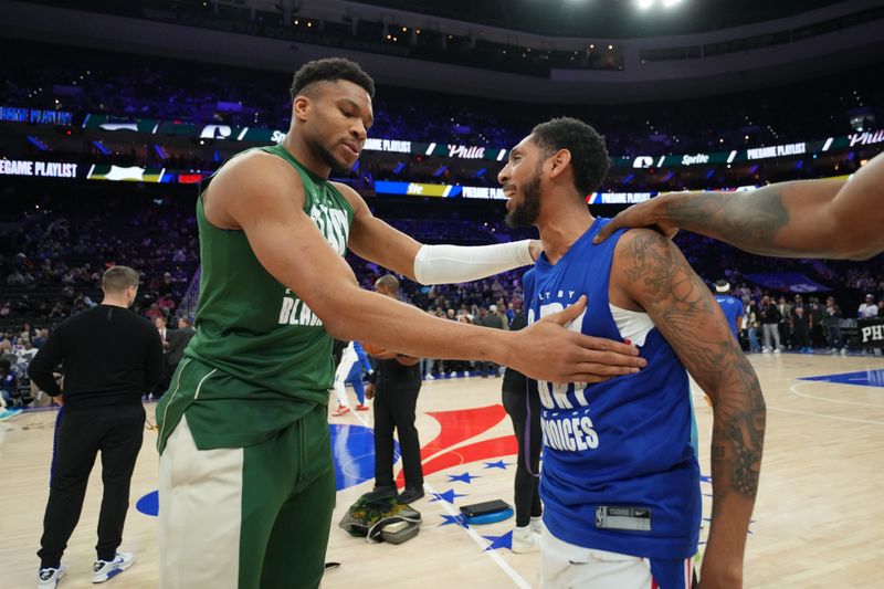 PHILADELPHIA, PA - FEBRUARY 25: Giannis Antetokounmpo #34 of the Milwaukee Bucks talks to Cameron Payne #22 of the Philadelphia 76ers before the game on February 25, 2024 at the Wells Fargo Center in Philadelphia, Pennsylvania NOTE TO USER: User expressly acknowledges and agrees that, by downloading and/or using this Photograph, user is consenting to the terms and conditions of the Getty Images License Agreement. Mandatory Copyright Notice: Copyright 2024 NBAE (Photo by Jesse D. Garrabrant/NBAE via Getty Images)