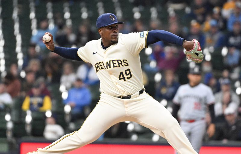 Apr 3, 2024; Milwaukee, Wisconsin, USA; Milwaukee Brewers relief pitcher Thyago Vieira (49) delivers a pitch against the Minnesota Twins in the ninth inning at American Family Field. Mandatory Credit: Michael McLoone-USA TODAY Sports