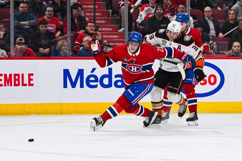 Feb 13, 2024; Montreal, Quebec, CAN; Montreal Canadiens defenseman Kaiden Guhle (21) defends against Anaheim Ducks right wing Jakob Silfverberg (33) during the third period at Bell Centre. Mandatory Credit: David Kirouac-USA TODAY Sports