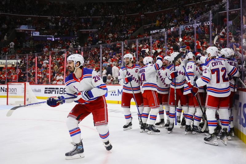 May 26, 2024; Sunrise, Florida, USA; New York Rangers celebrate an overtime goal by New York Rangers center Alex Wennberg (91) to defeat the Florida Panthers in game three of the Eastern Conference Final of the 2024 Stanley Cup Playoffs at Amerant Bank Arena. Mandatory Credit: Sam Navarro-USA TODAY Sports