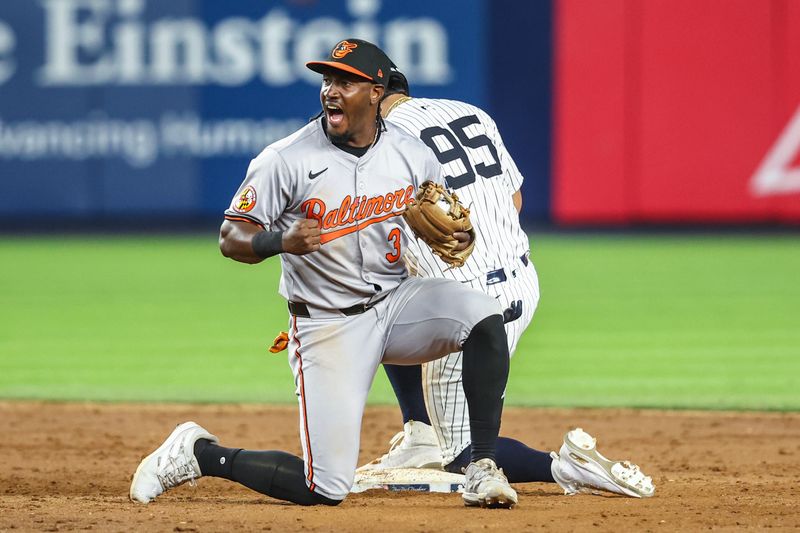 Jun 19, 2024; Bronx, New York, USA;  Baltimore Orioles second baseman Jorge Mateo (3) reacts after tagging out New York Yankees pinch runner Oswaldo Cabrera (95) attempting to steal to second base in the tenth inning at Yankee Stadium. Mandatory Credit: Wendell Cruz-USA TODAY Sports