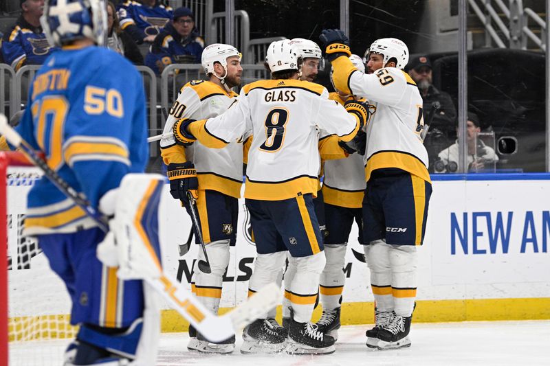 Feb 17, 2024; St. Louis, Missouri, USA; Nashville Predators left wing Filip Forsberg (9) is congratulated by teammates after scoring a goal against the St. Louis Blues during the third period at Enterprise Center. Mandatory Credit: Jeff Le-USA TODAY Sports