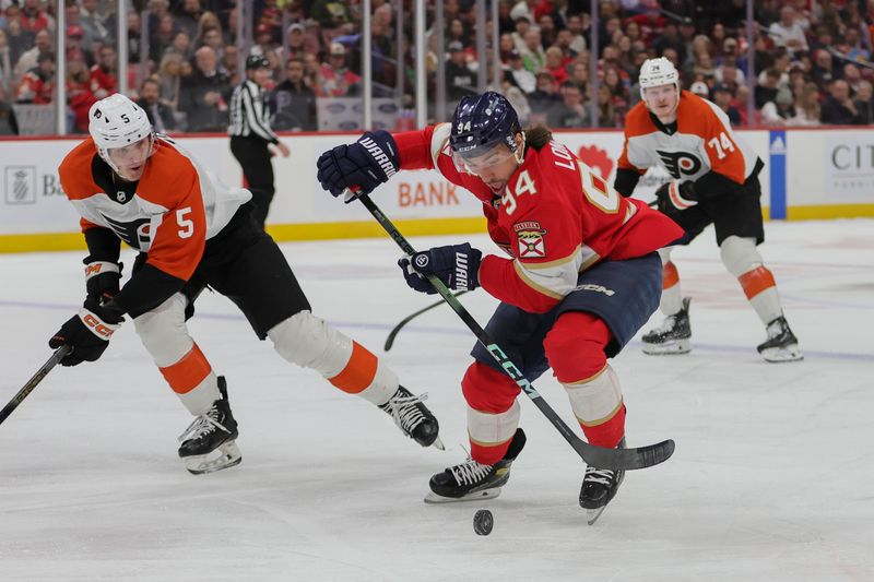 Feb 6, 2024; Sunrise, Florida, USA; Florida Panthers left wing Ryan Lomberg (94) moves the puck past Philadelphia Flyers defenseman Egor Zamula (5) during the second period at Amerant Bank Arena. Mandatory Credit: Sam Navarro-USA TODAY Sports