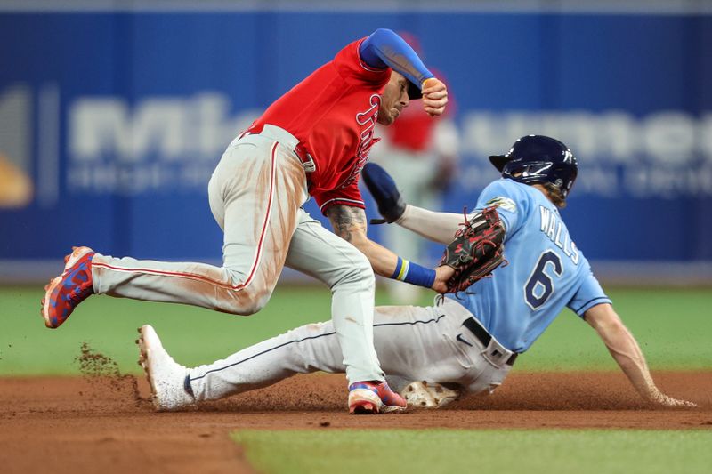 Jul 6, 2023; St. Petersburg, Florida, USA;  Tampa Bay Rays second baseman Taylor Walls (6) steals second base from Philadelphia Phillies second baseman Bryson Stott (5) in the eighth inning at Tropicana Field. Mandatory Credit: Nathan Ray Seebeck-USA TODAY Sports