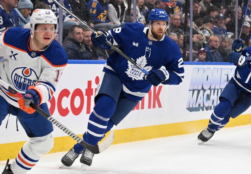 Nov 16, 2024; Toronto, Ontario, CAN;  Toronto Maple Leafs defenseman Jani Hakanpaa (28) pursues the play against the Edmonton Oilers in the second period at Scotiabank Arena. Mandatory Credit: Dan Hamilton-Imagn Images