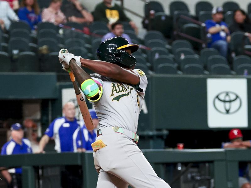 Apr 30, 2025; Arlington, Texas, USA;  Oakland Athletics right fielder Lawrence Butler (4) hits a grand slam during the ninth inning against the Texas Rangers at Globe Life Field. Mandatory Credit: Kevin Jairaj-Imagn Images