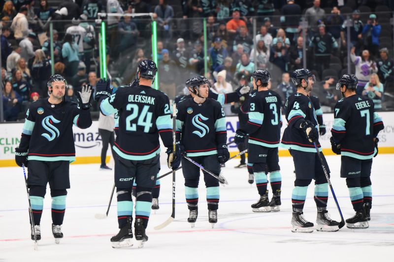 Nov 2, 2023; Seattle, Washington, USA; The Seattle Kraken celebrate defeating the Nashville Predators at Climate Pledge Arena. Mandatory Credit: Steven Bisig-USA TODAY Sports