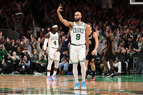 BOSTON, MASSACHUSETTS - DECEMBER 28: Derrick White #9 of the Boston Celtics reacts after scoring a three-point basket against the Detroit Pistons during overtime at TD Garden on December 28, 2023 in Boston, Massachusetts. NOTE TO USER: User expressly acknowledges and agrees that, by downloading and or using this photograph, User is consenting to the terms and conditions of the Getty Images License Agreement. (Photo by Brian Fluharty/Getty Images)