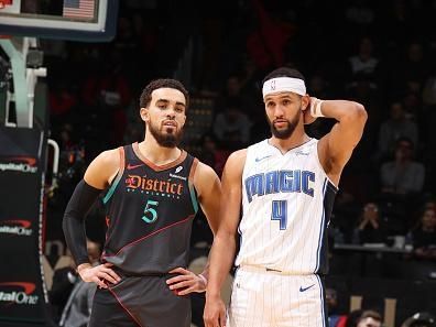 WASHINGTON, DC -? DECEMBER 26:  Tyus Jones #5 of the Washington Wizards & Jalen Suggs #4 of the Orlando Magic looks on during the game on December 26, 2023 at Capital One Arena in Washington, DC. NOTE TO USER: User expressly acknowledges and agrees that, by downloading and or using this Photograph, user is consenting to the terms and conditions of the Getty Images License Agreement. Mandatory Copyright Notice: Copyright 2023 NBAE (Photo by Stephen Gosling/NBAE via Getty Images)