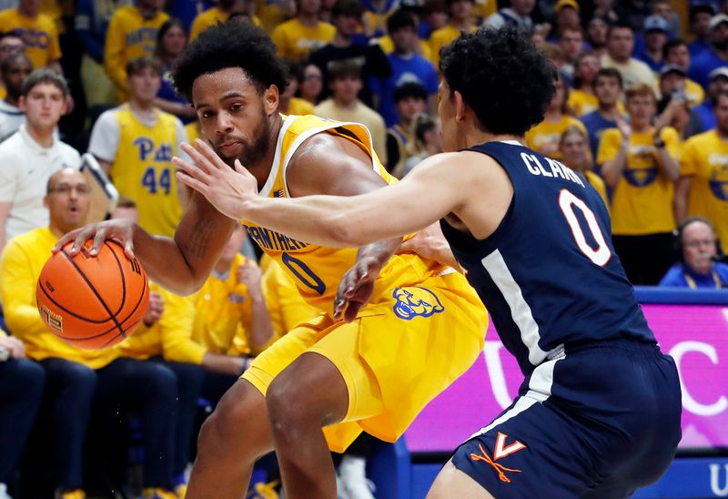 Jan 3, 2023; Pittsburgh, Pennsylvania, USA;  Pittsburgh Panthers guard Nelly Cummings (left) handles the ball against Virginia Cavaliers guard Kihei Clark (right) during the second half at the Petersen Events Center. Pittsburgh won 68-65. Mandatory Credit: Charles LeClaire-USA TODAY Sports