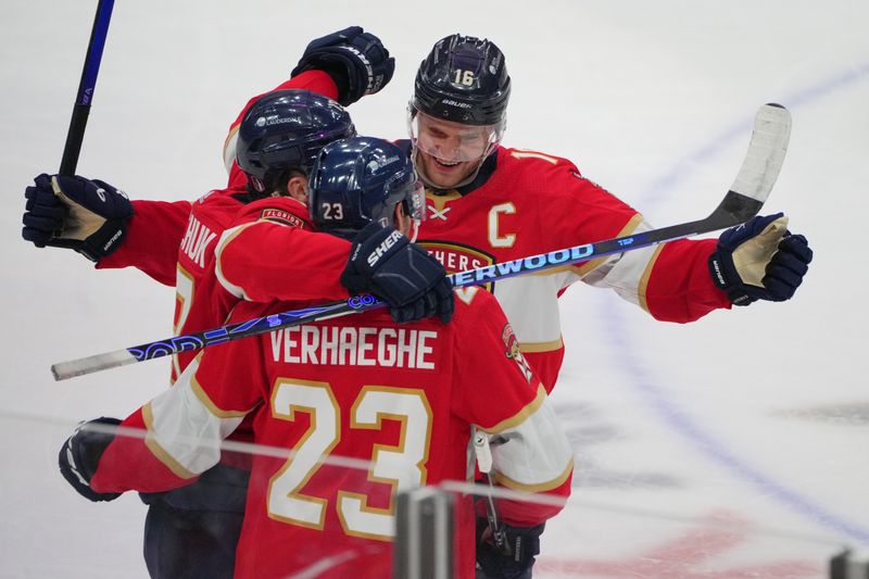 Apr 29, 2024; Sunrise, Florida, USA; Florida Panthers center Aleksander Barkov (16) celebrates a goal by Florida Panthers center Carter Verhaeghe (23) during the third period in game five of the first round of the 2024 Stanley Cup Playoffs against the Tampa Bay Lightning at Amerant Bank Arena. Mandatory Credit: Jim Rassol-USA TODAY Sports