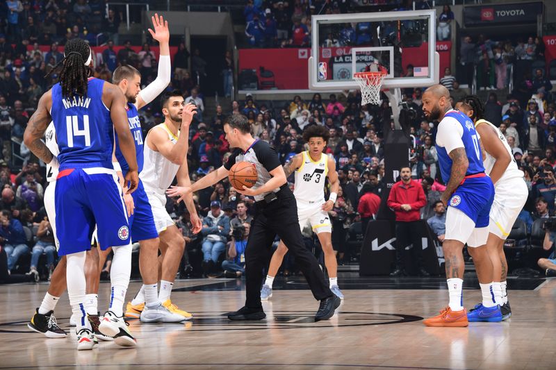 LOS ANGELES, CA - APRIL 5:  Open tip-off between Ivica Zubac #40 of the LA Clippers & Omer Yurtseven #77 of the Utah Jazz on April 5, 2024 at Crypto.Com Arena in Los Angeles, California. NOTE TO USER: User expressly acknowledges and agrees that, by downloading and/or using this Photograph, user is consenting to the terms and conditions of the Getty Images License Agreement. Mandatory Copyright Notice: Copyright 2024 NBAE (Photo by Adam Pantozzi/NBAE via Getty Images)