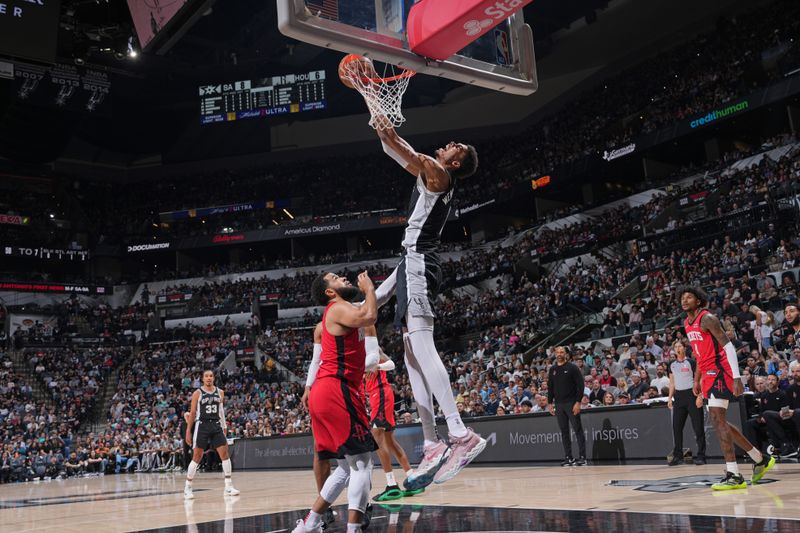 SAN ANTONIO, TX - MARCH 12: Victor Wembanyama #1 of the San Antonio Spurs drives to the basket during the game against the Houston Rockets on March 12, 2024 at the Frost Bank Center in San Antonio, Texas. NOTE TO USER: User expressly acknowledges and agrees that, by downloading and or using this photograph, user is consenting to the terms and conditions of the Getty Images License Agreement. Mandatory Copyright Notice: Copyright 2024 NBAE (Photos by Jesse D. Garrabrant/NBAE via Getty Images)