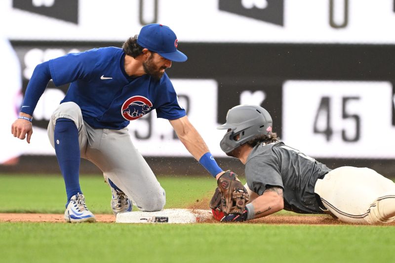 Aug 31, 2024; Washington, District of Columbia, USA; Chicago Cubs shortstop Dansby Swanson (7) tags out Washington Nationals right fielder Dylan Crews (3) at second base during a stolen base attempts during the seventh inning at Nationals Park. Mandatory Credit: Rafael Suanes-USA TODAY Sports