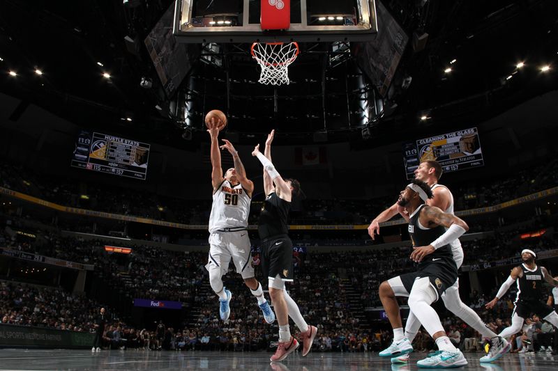 MEMPHIS, TN - APRIL 14:  Aaron Gordon #50 of the Denver Nuggets drives to the basket during the game against the Memphis Grizzlies on April 14, 2024 at FedExForum in Memphis, Tennessee. NOTE TO USER: User expressly acknowledges and agrees that, by downloading and or using this photograph, User is consenting to the terms and conditions of the Getty Images License Agreement. Mandatory Copyright Notice: Copyright 2024 NBAE (Photo by Joe Murphy/NBAE via Getty Images)