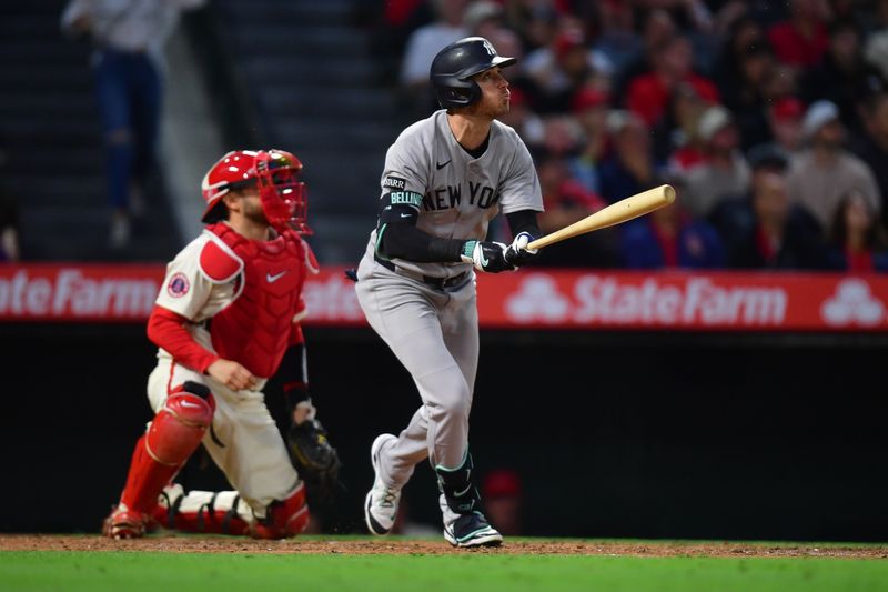 May 27, 2025; Anaheim, California, USA; New York Yankees left fielder Cody Bellinger (35) hits a single against the Los Angeles Angels during the sixth inning at Angel Stadium. Mandatory Credit: Gary A. Vasquez-Imagn Images