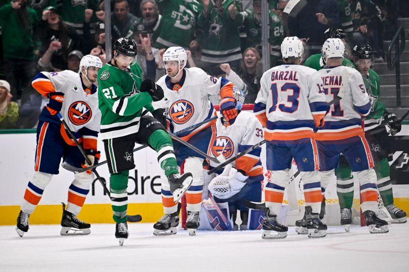 Nov 18, 2025; Dallas, Texas, USA; Dallas Stars left wing Jason Robertson (21) celebrates after he scores his second goal against the New York Islanders during the third period at the American Airlines Center. Mandatory Credit: Jerome Miron-Imagn Images